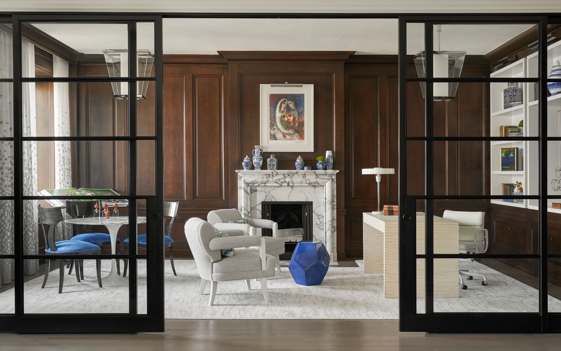 A living room with a fireplace and sliding glass doors.