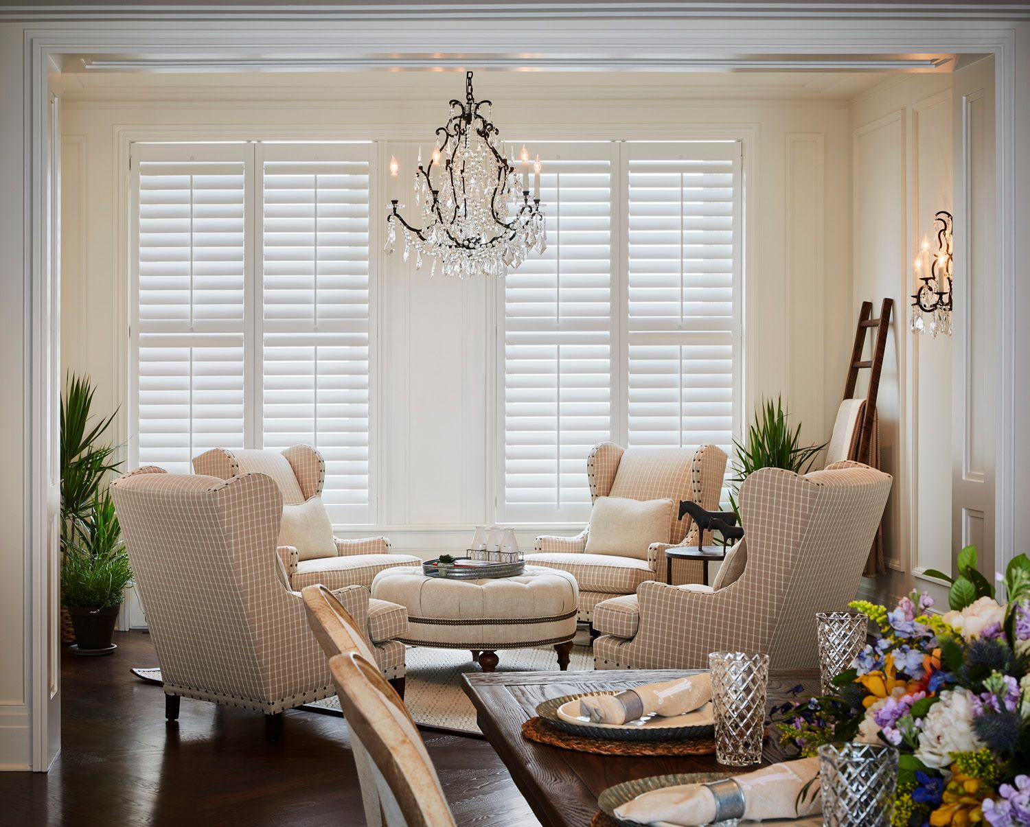 A living room filled with furniture and a chandelier.
