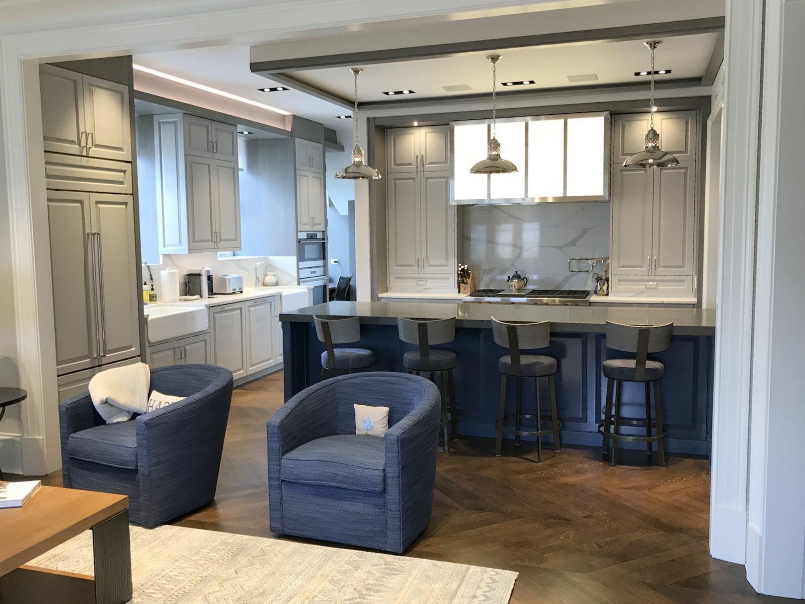 A living room filled with furniture and a kitchen.