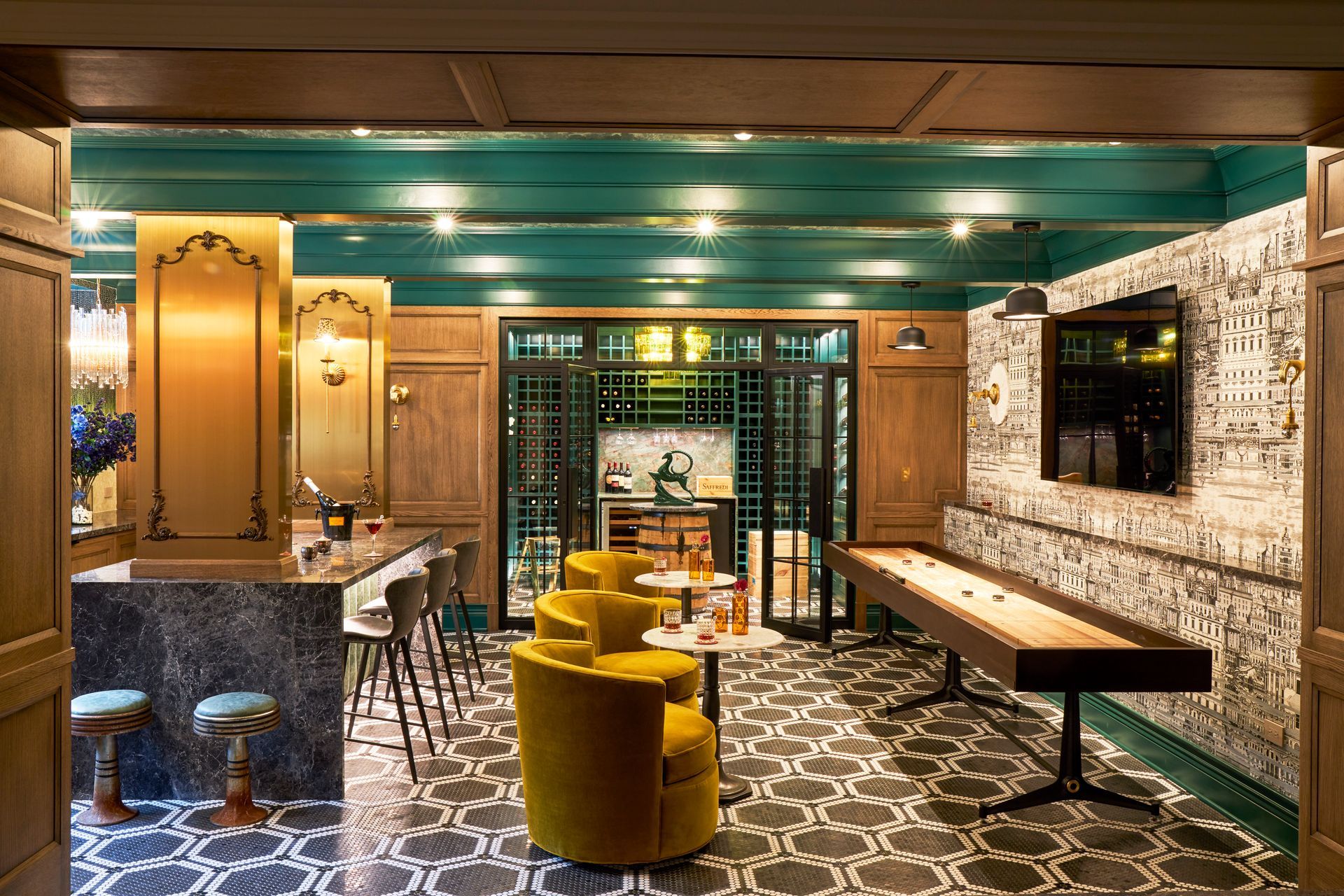 There is a shuffleboard table in the middle of the room.