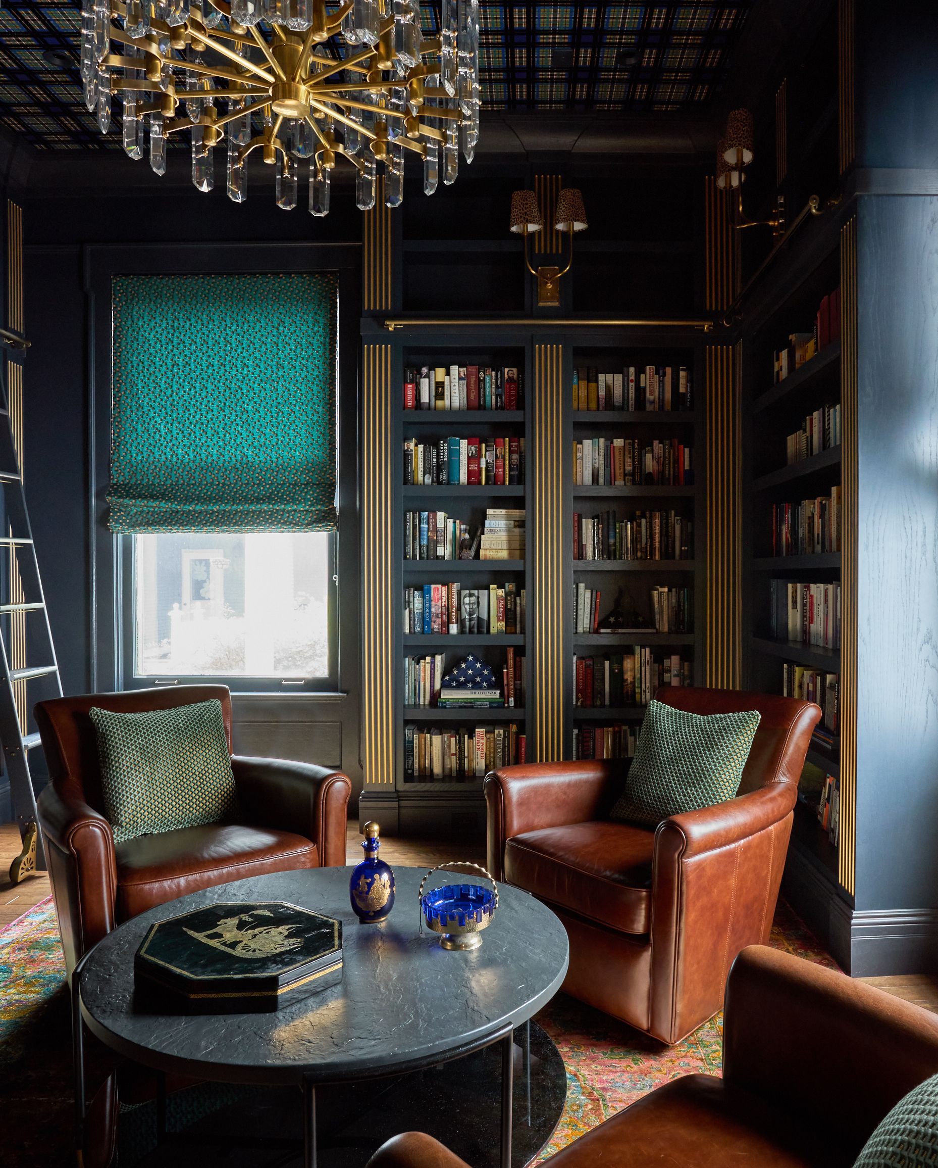 A living room filled with furniture and bookshelves
