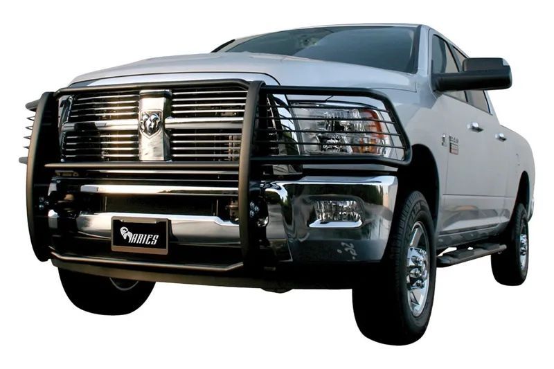 Silver Dodge Ram pickup truck with black grille guard.