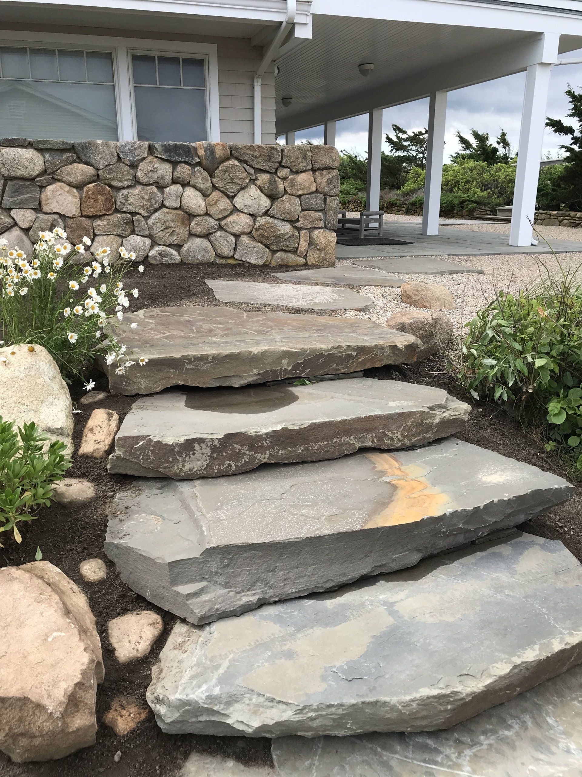 A set of stone steps leading up to a house