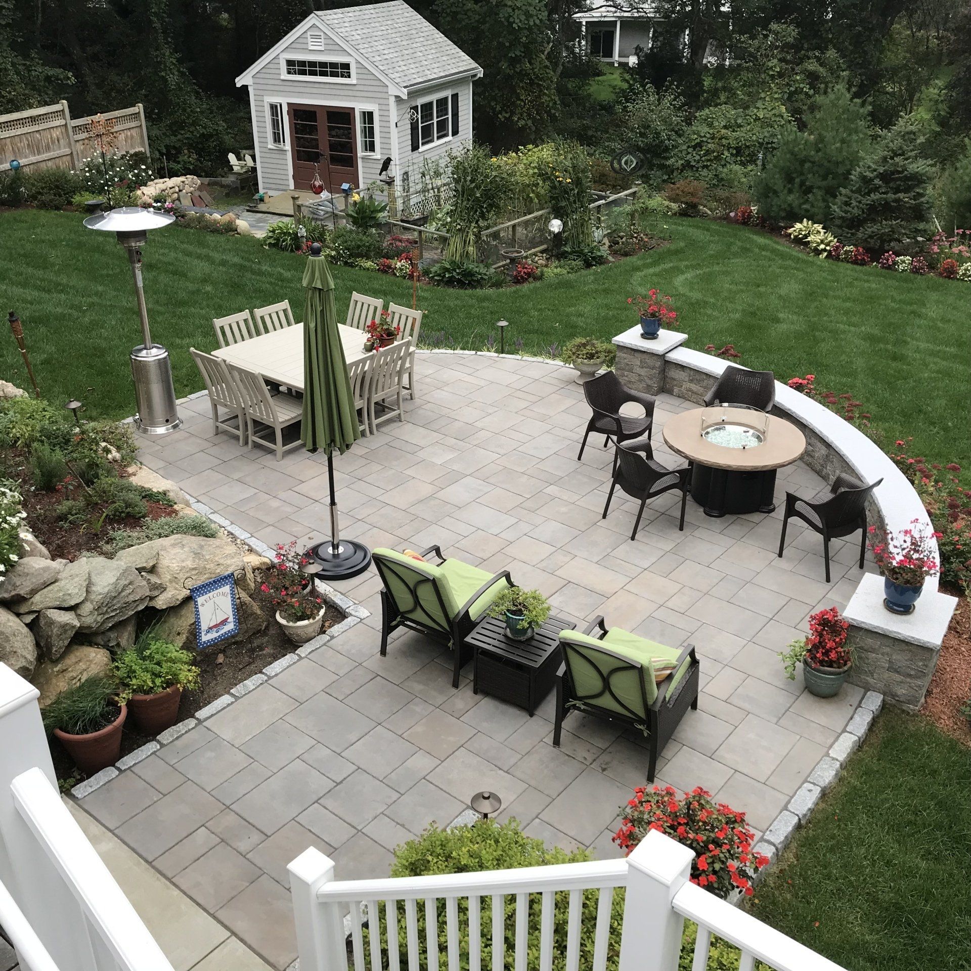 An aerial view of a patio with a table and chairs