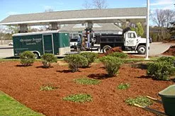 A truck is parked in front of a gas station
