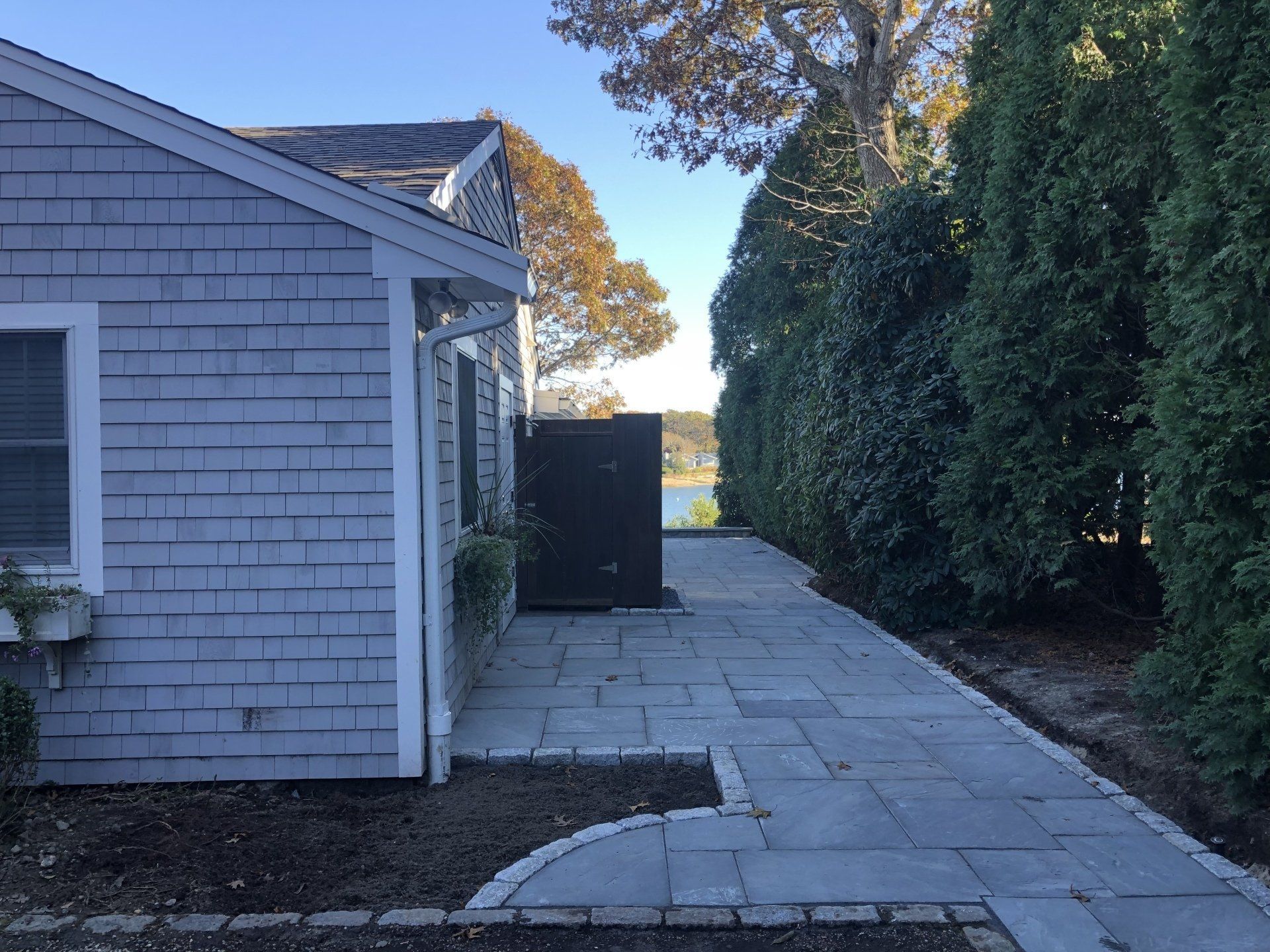 A brick house with a walkway leading to it.