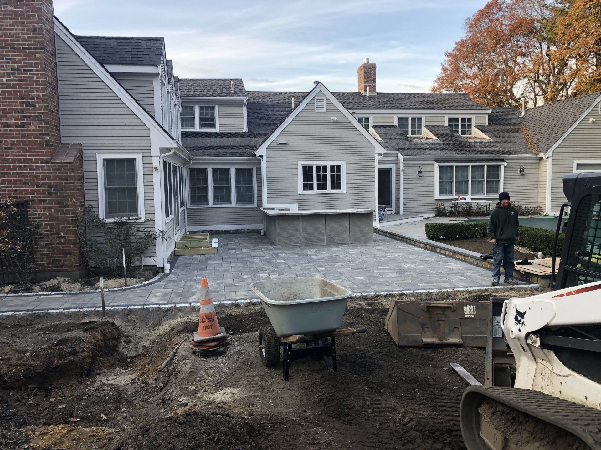 A man is currently building a patio.