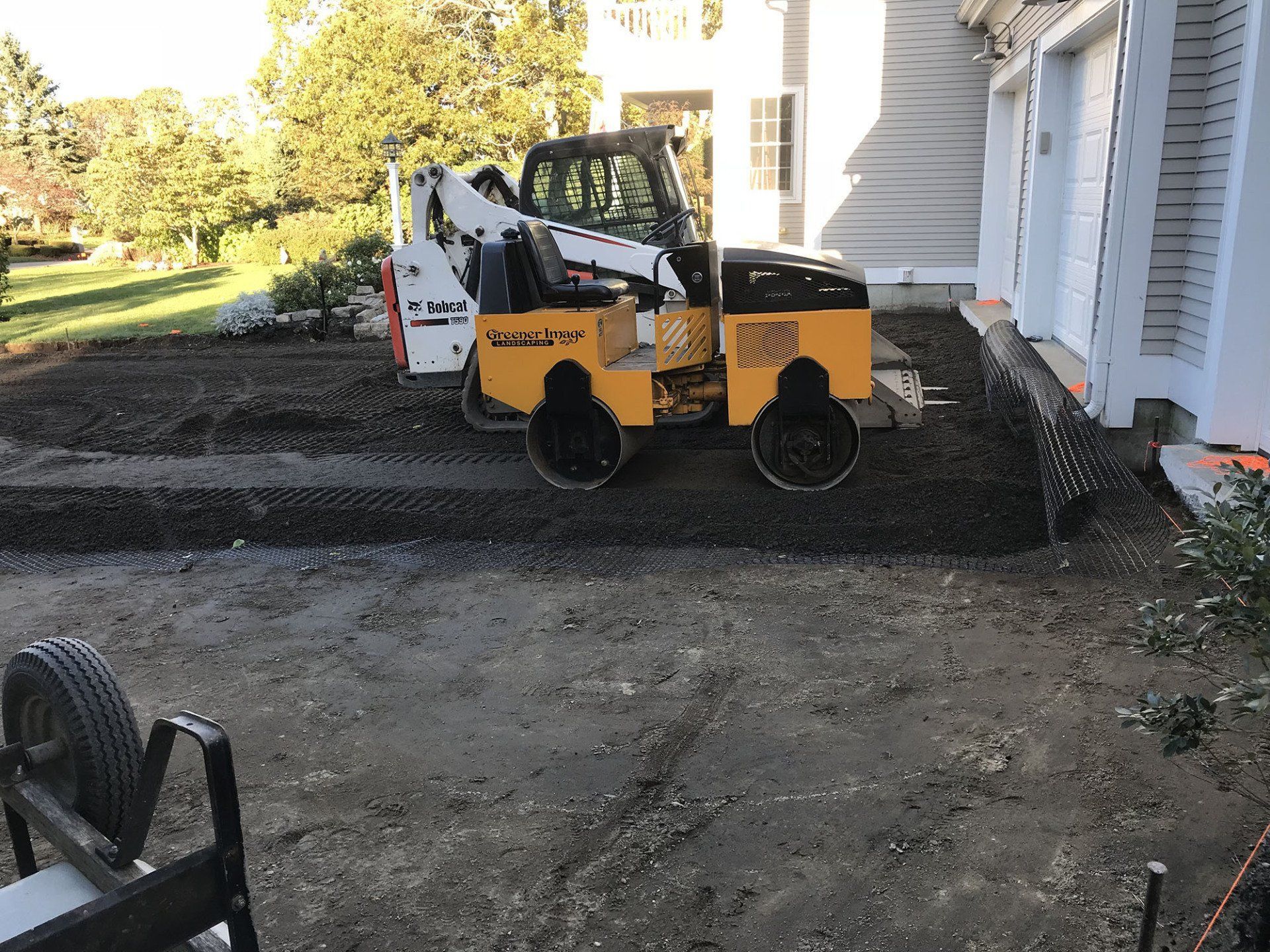 A bulldozer is being used for the construction of a driveway.