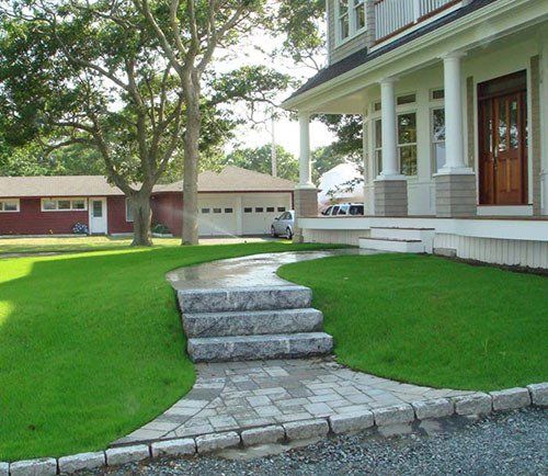 A house with stairs leading up to the front door
