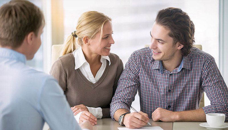 Couple about to sign an insurance agreement