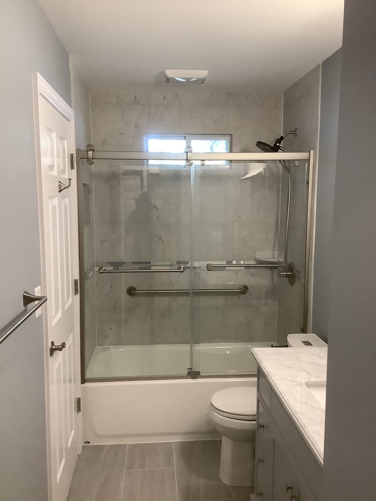 Bathroom with a tub, toilet, sink, and shower