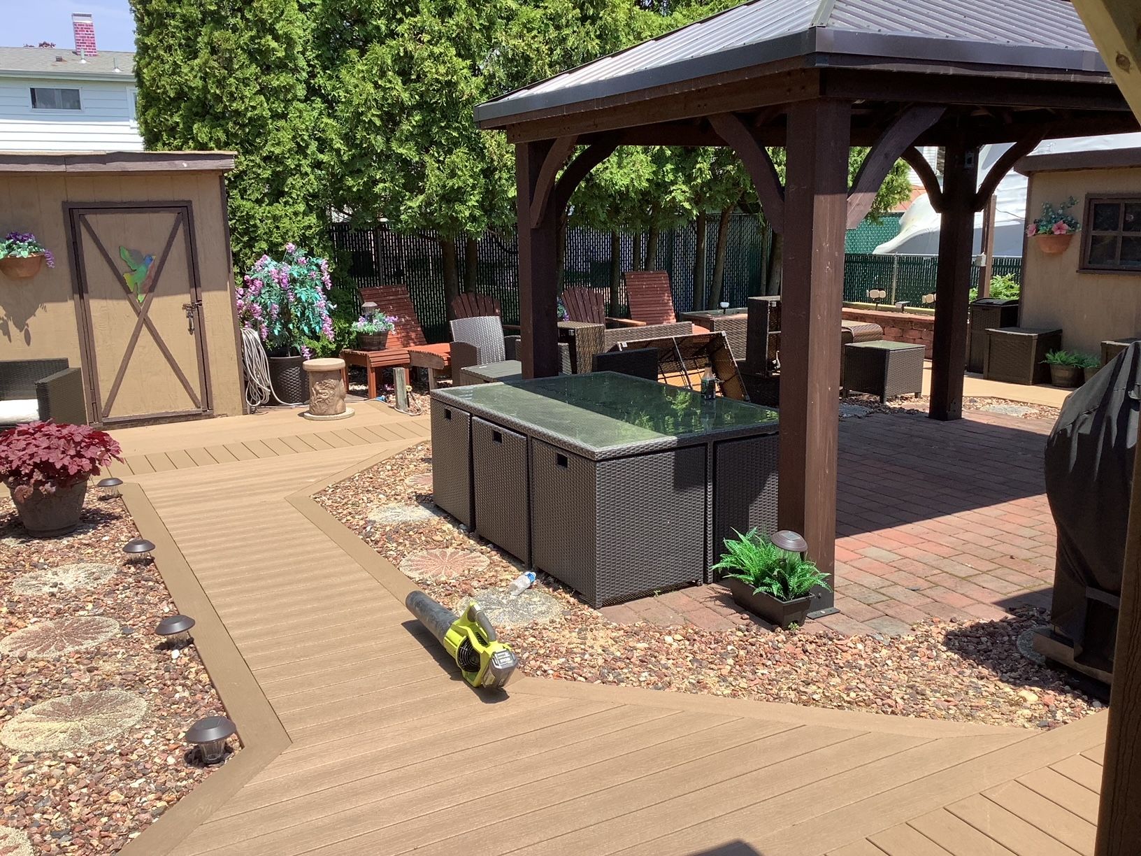 There is a gazebo in the middle of the backyard