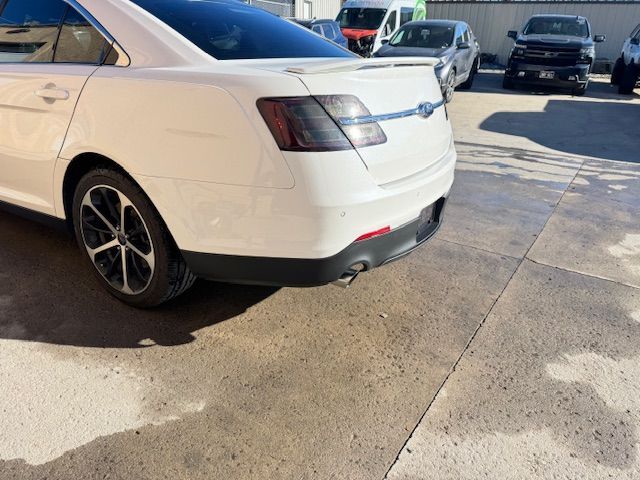 A white suv is parked in a garage.