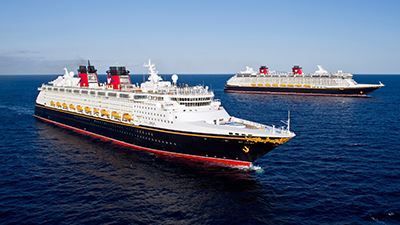 Two cruise ships are floating in the ocean.