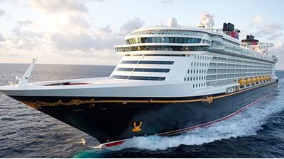 A large cruise ship is floating on top of a body of water.