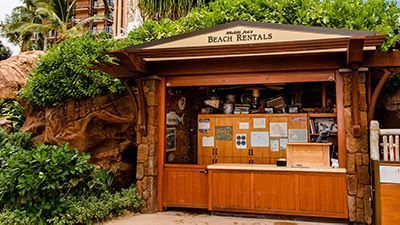 A wooden building with a sign that says beach rentals