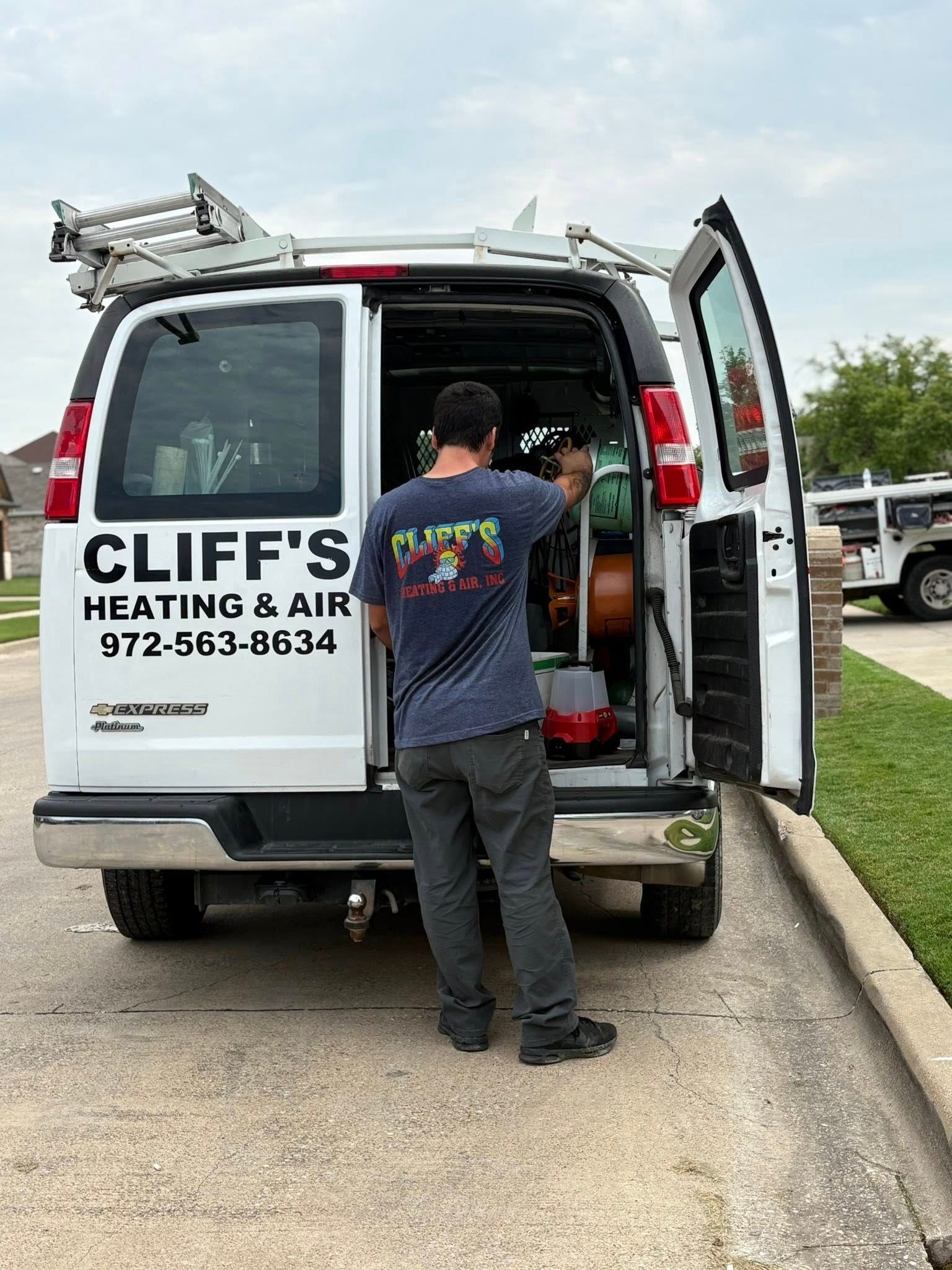 HVAC technician at white van
