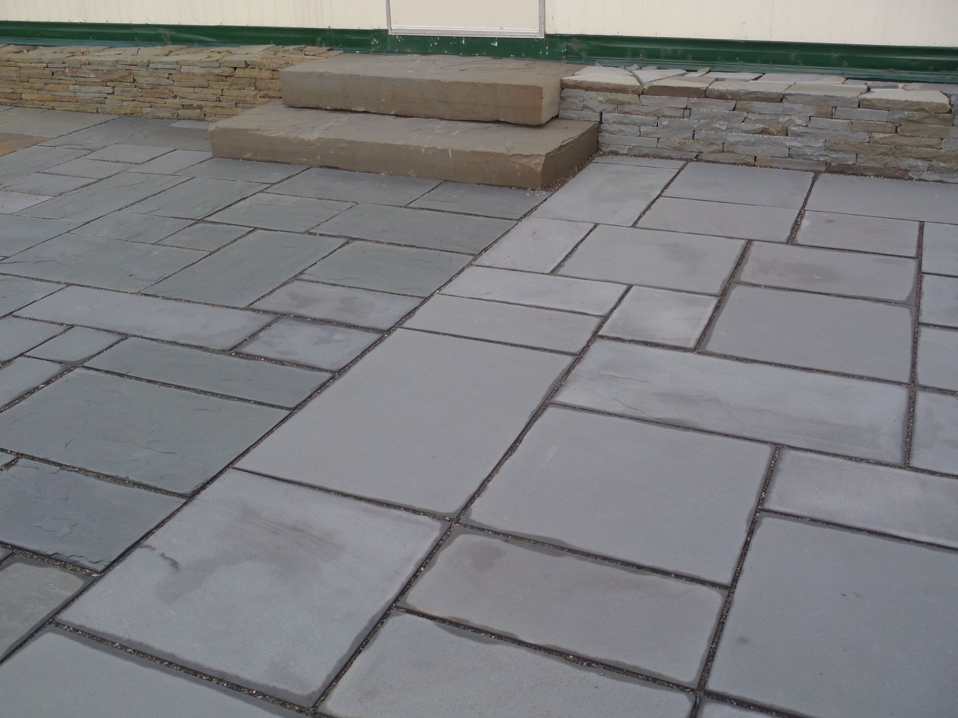 a brick walkway with steps leading up to it