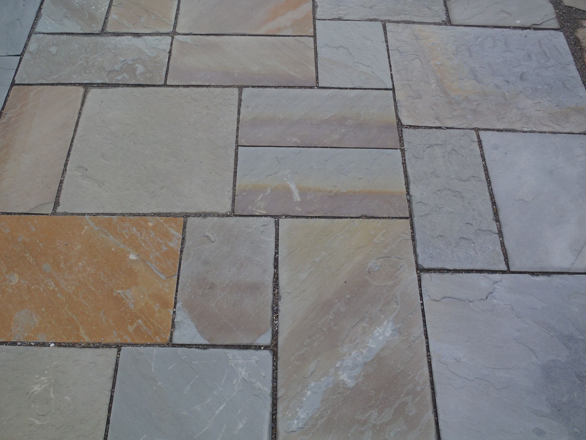 a close up of a tiled floor with a diagonal pattern