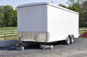 Large white trailer used for hauling and transporting