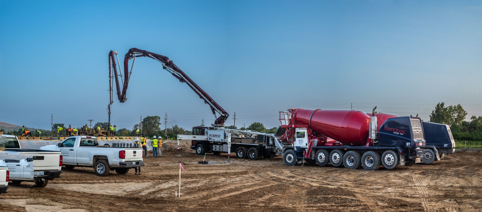 A concrete pump is being used to pump concrete into a construction site.