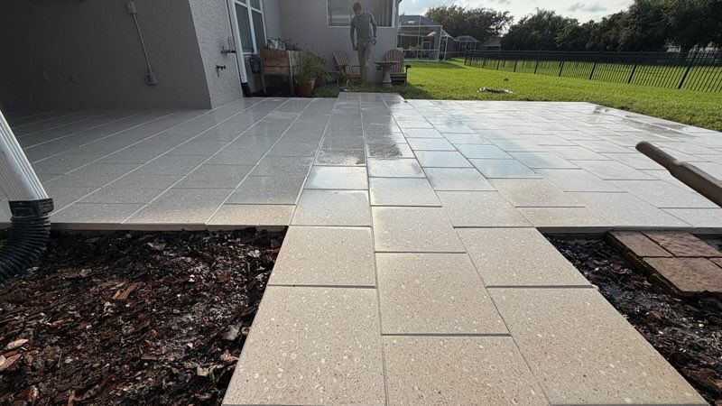 Tiled patio walkway in front of a house