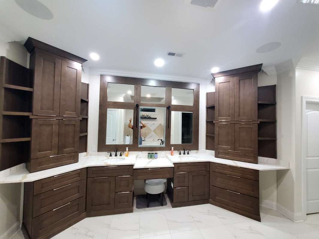 A bathroom with two sinks and a large mirror