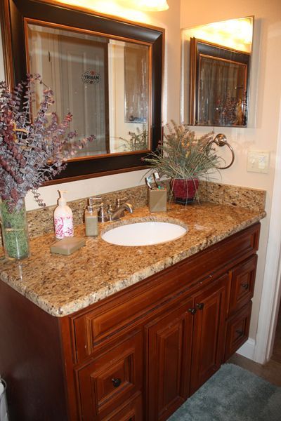 A bathroom vanity with a sink and a mirror