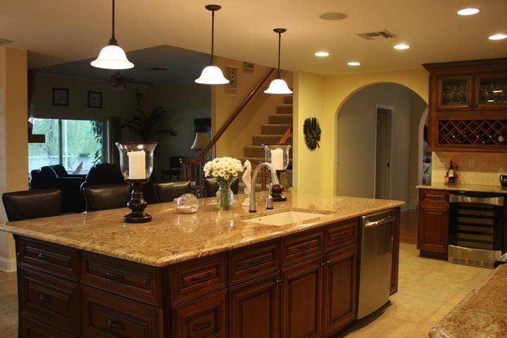 A kitchen with a large island and a sink