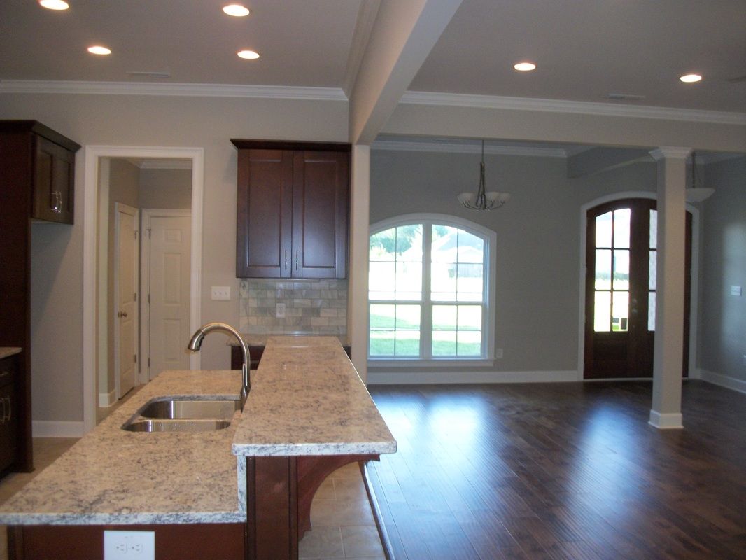 A kitchen with granite counter tops and a sink