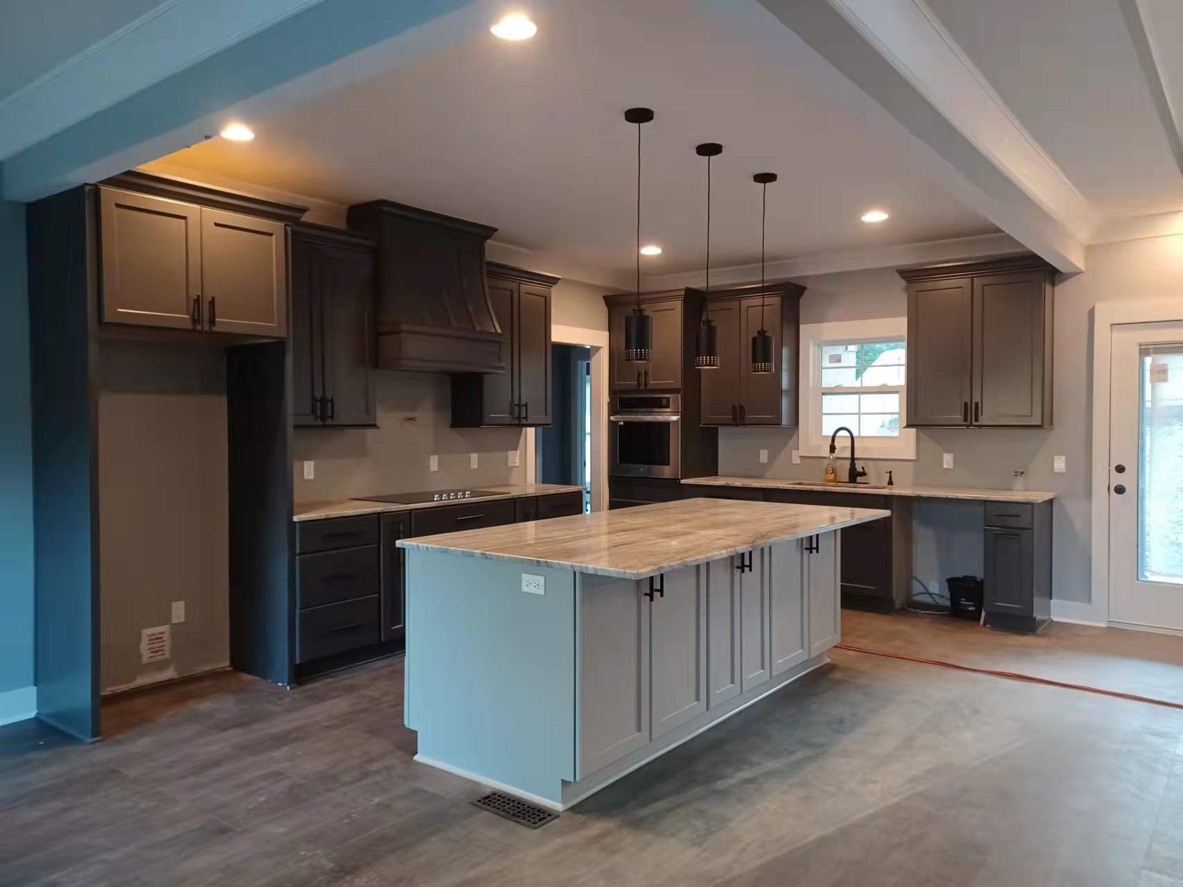 A kitchen with a large island in the middle of it.