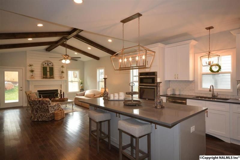 A kitchen with a large island in the middle of the room.