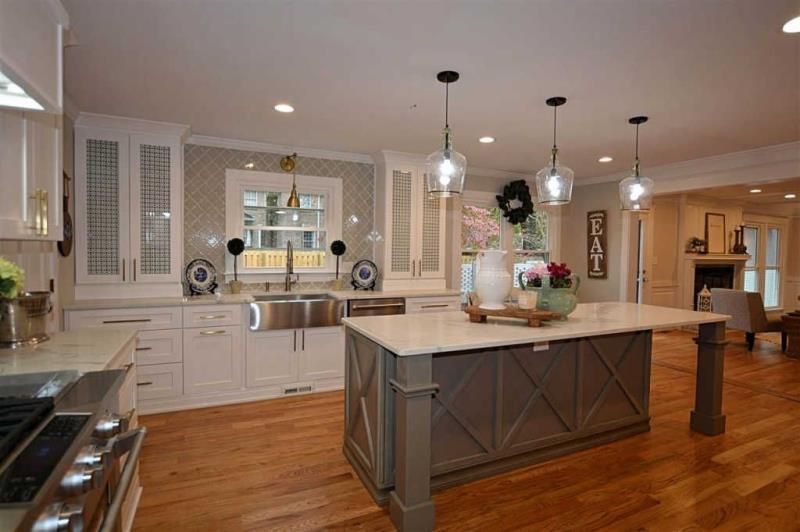 A kitchen with a large island in the middle of it.