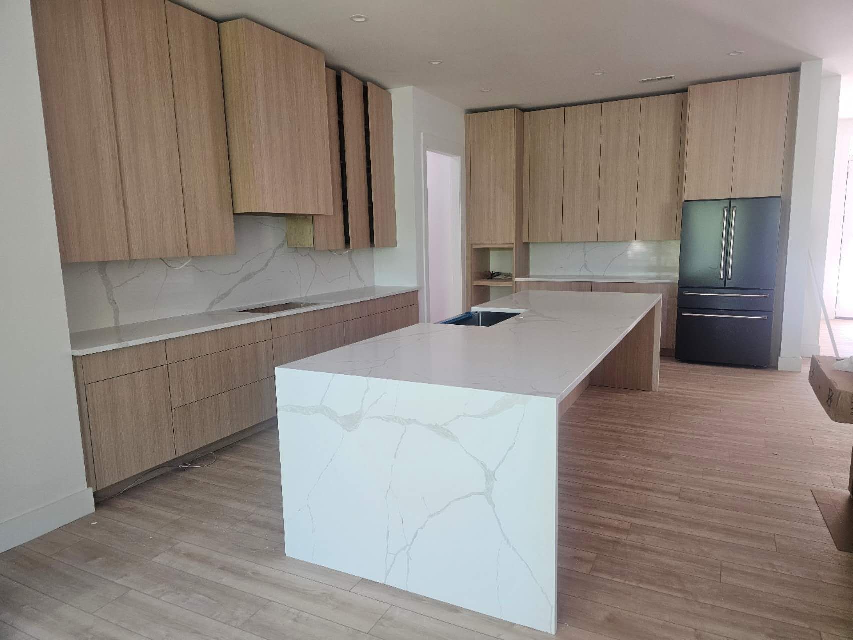 There is a large island in the middle of the kitchen.