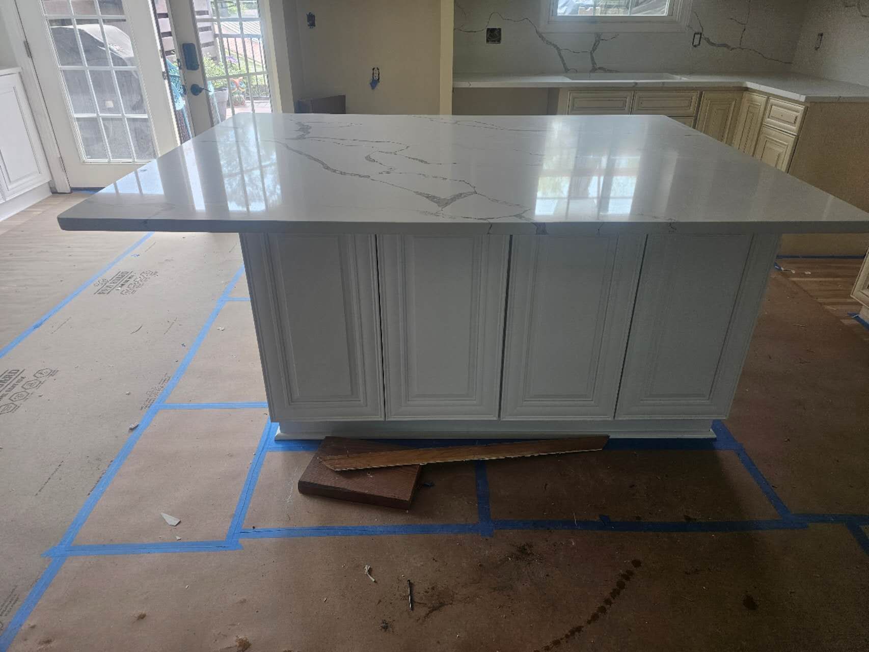 A kitchen with a large island in the middle of the room.