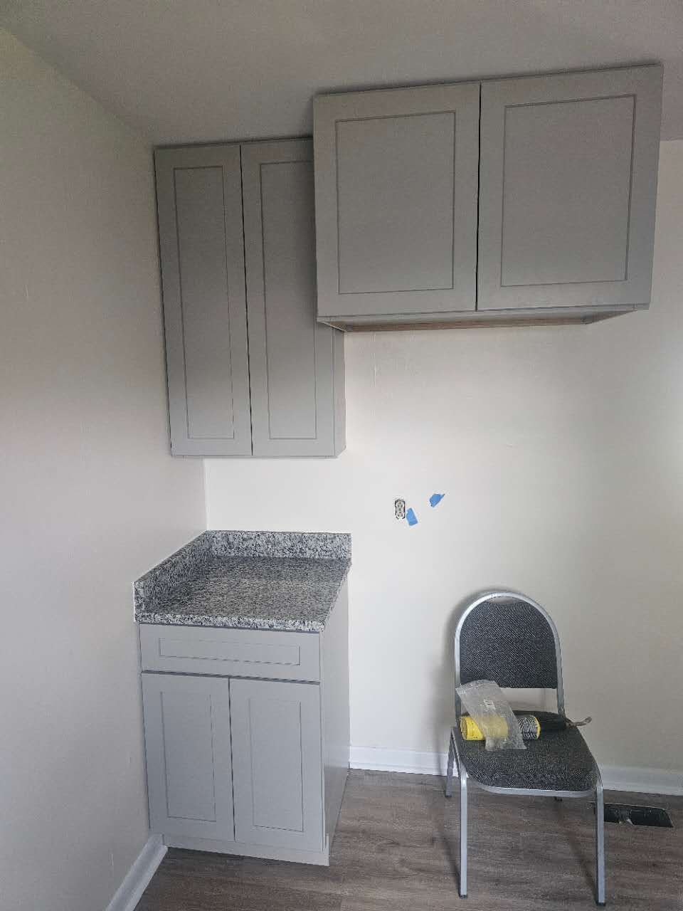 There is a chair in the corner of the room.