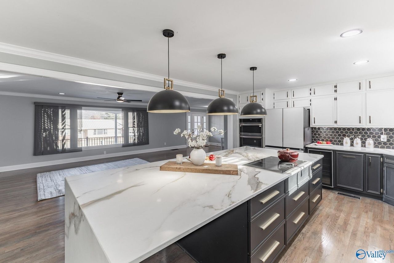 There is a large island in the middle of the kitchen.