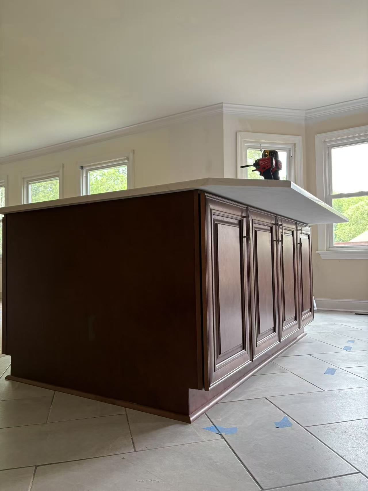 A kitchen with a large island in the middle of the room.