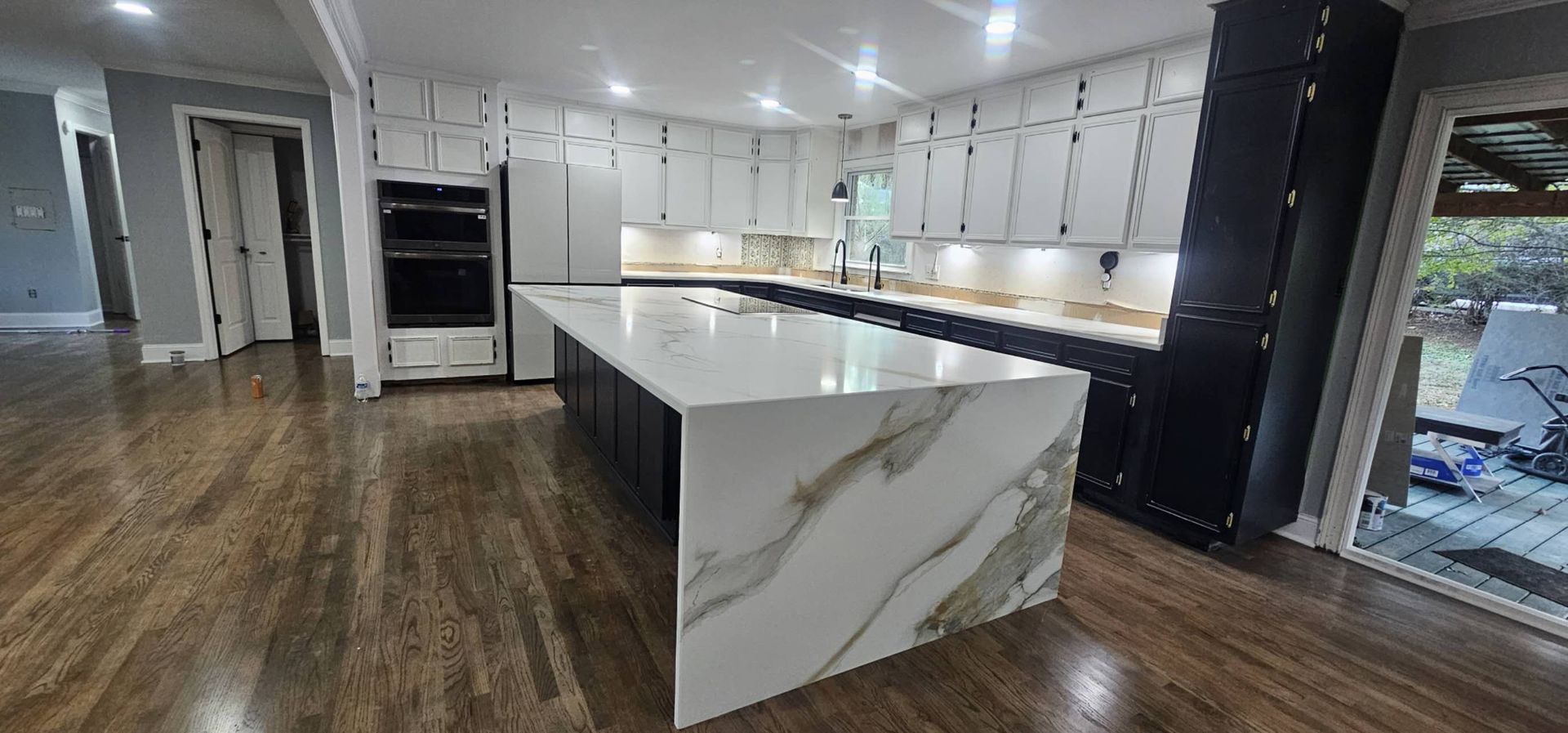 There is a large island in the middle of the kitchen.