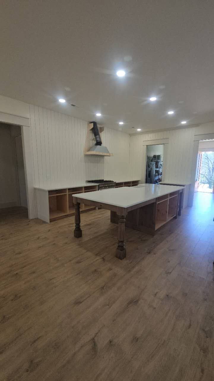 There is a large table in the middle of the room.