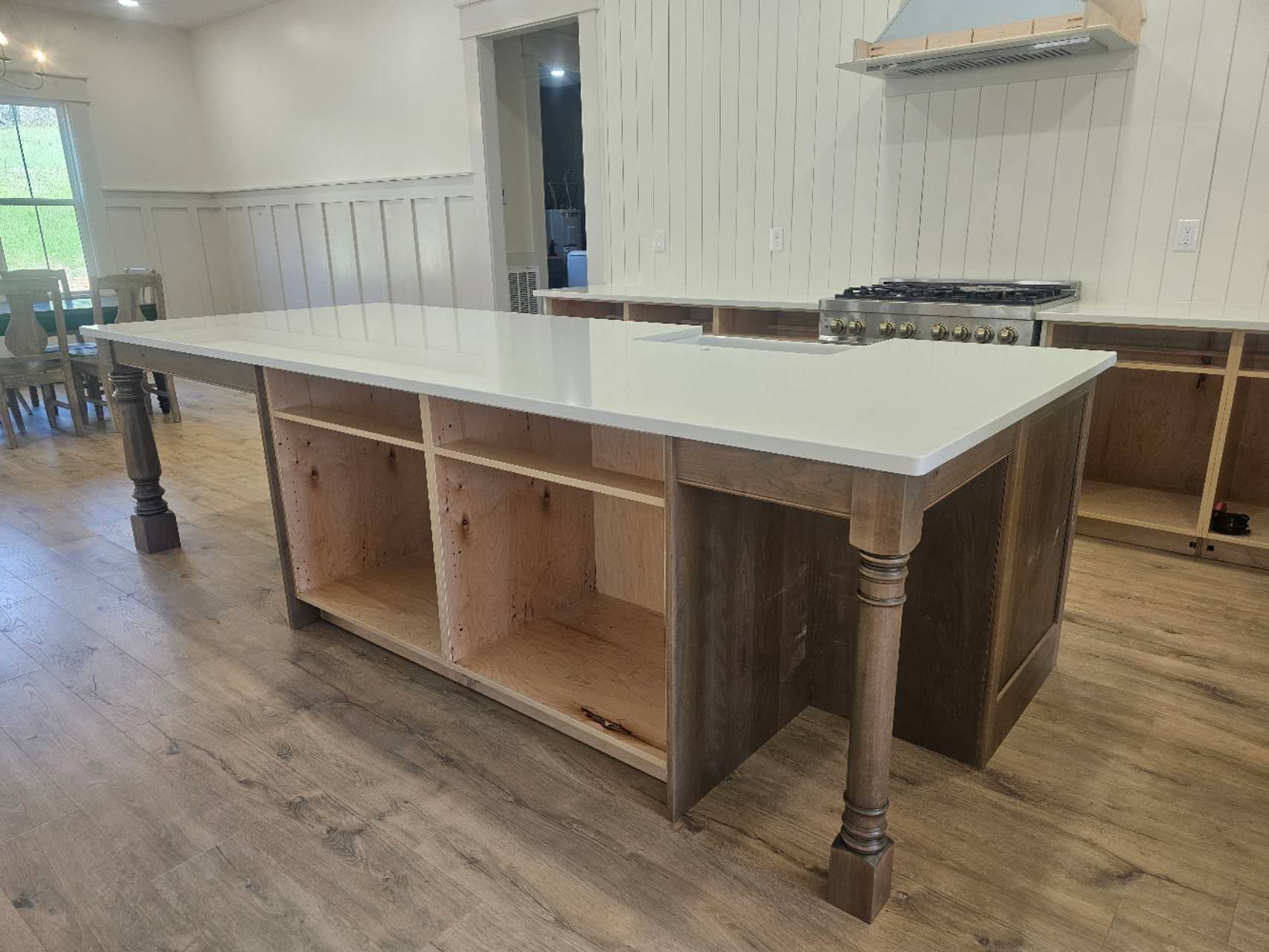 A kitchen with a large island in the middle of the room.