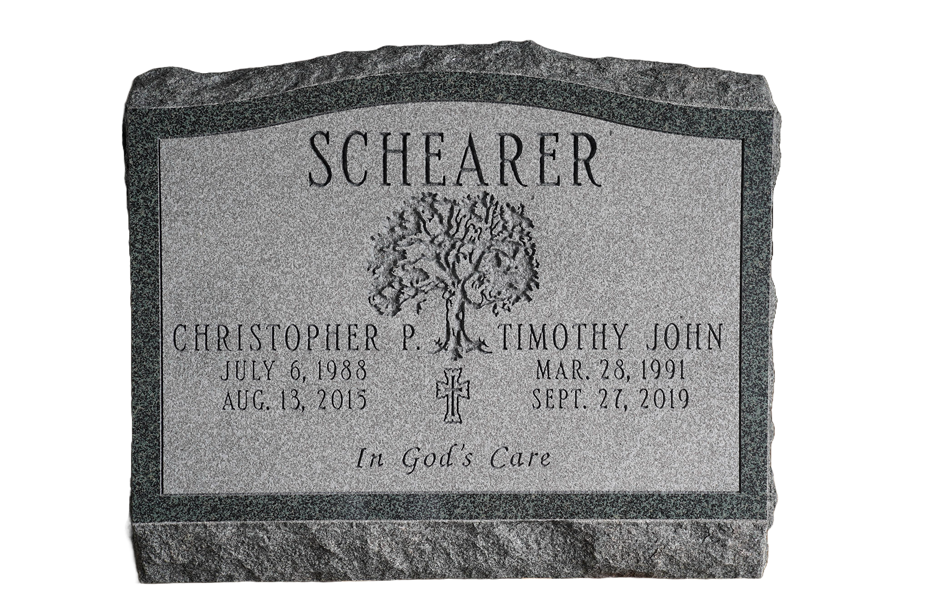 A gravestone for a man named schearer with a tree on it.