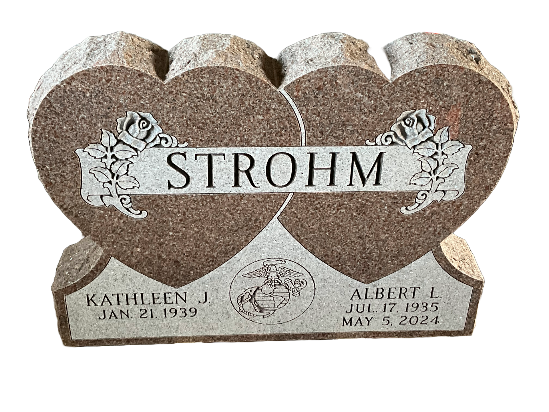 A gravestone in the shape of two hearts with the name strohm on it.