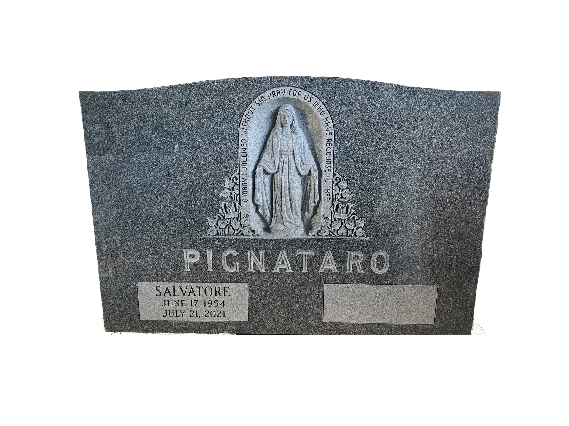 A gravestone with a statue of the virgin mary on it.