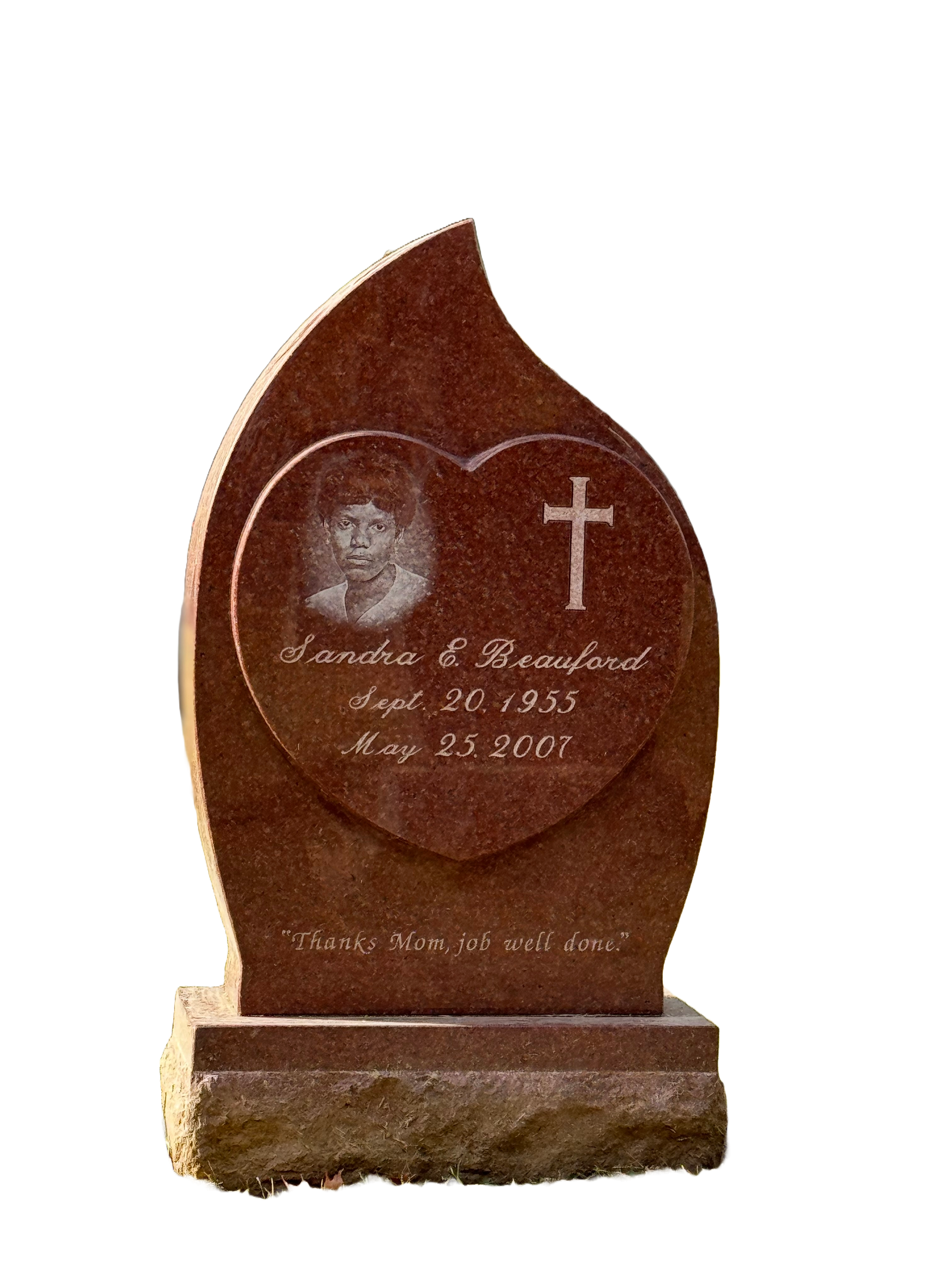 A gravestone with a heart and a cross on it