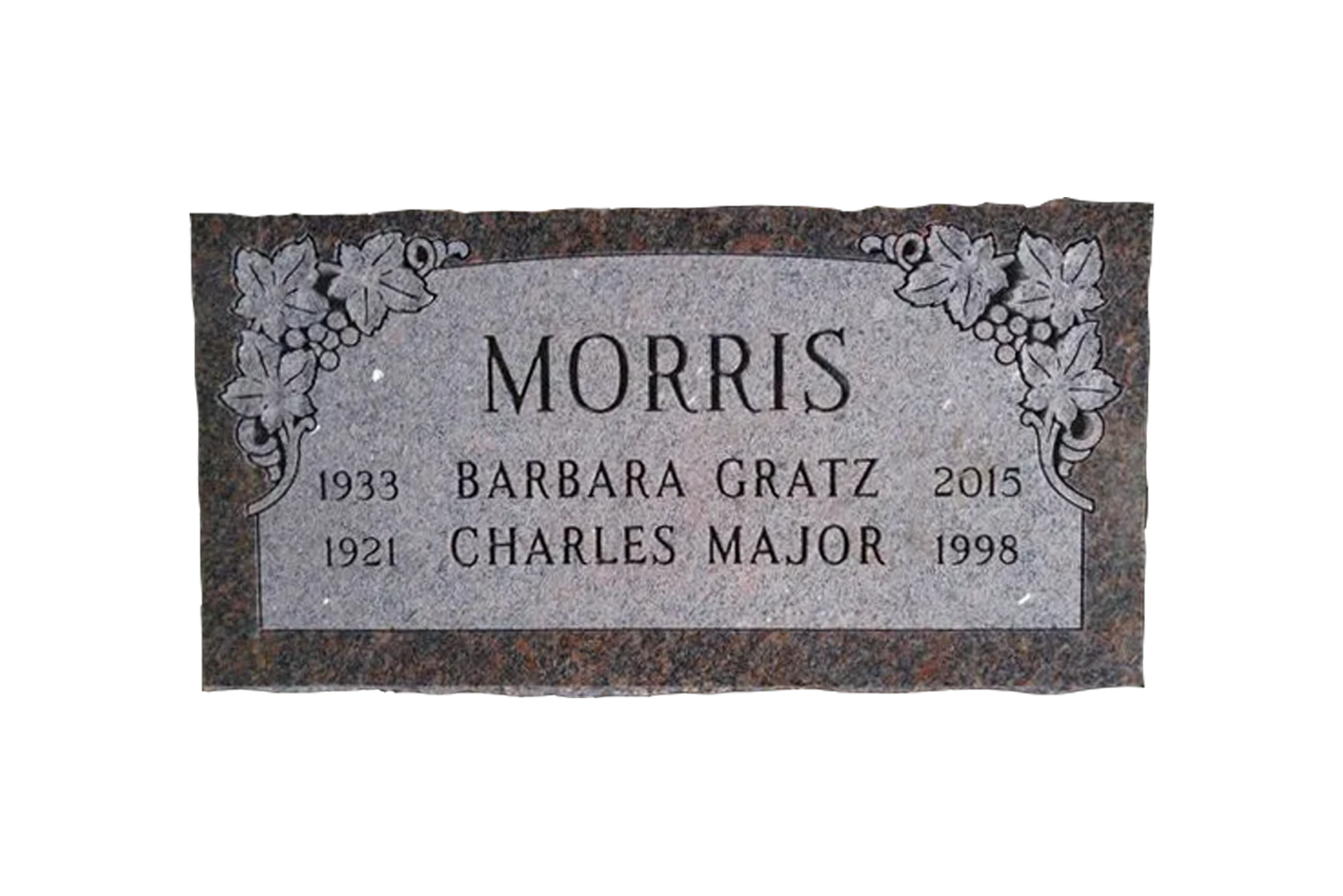 A gravestone for morris barbara gratz is sitting on a wooden stand.