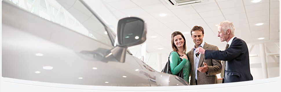 Couple receiving auto key / Auto Insurance | Roslindale, MA | CJM Insurance | 617-323-7696