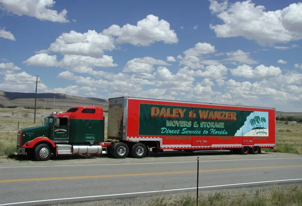 Daley & Wanzer moving van on the road.