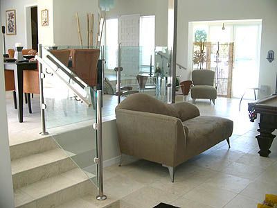 A living room with a couch and a pool table