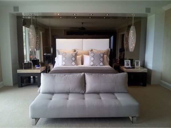 A bedroom with a large bed and a couch